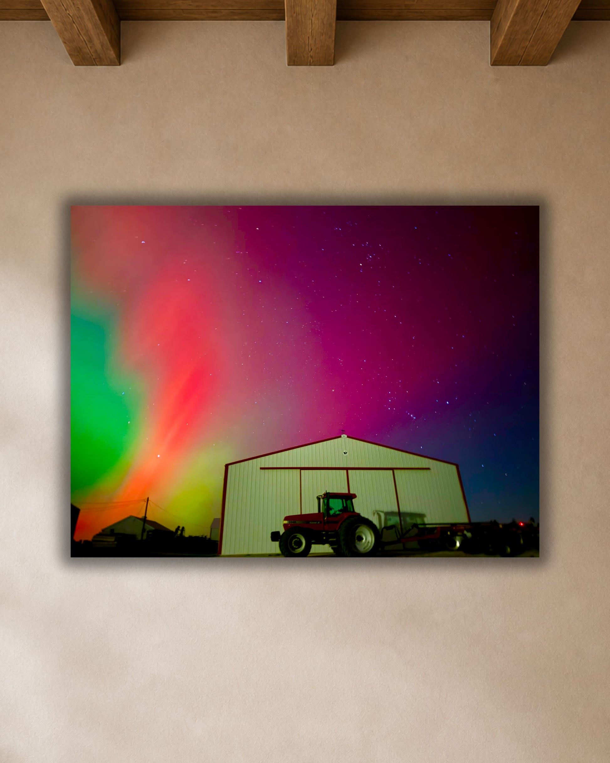 Close-up of northern lights farm canvas print featuring a tractor and shed beneath vivid pink, green, and violet aurora.