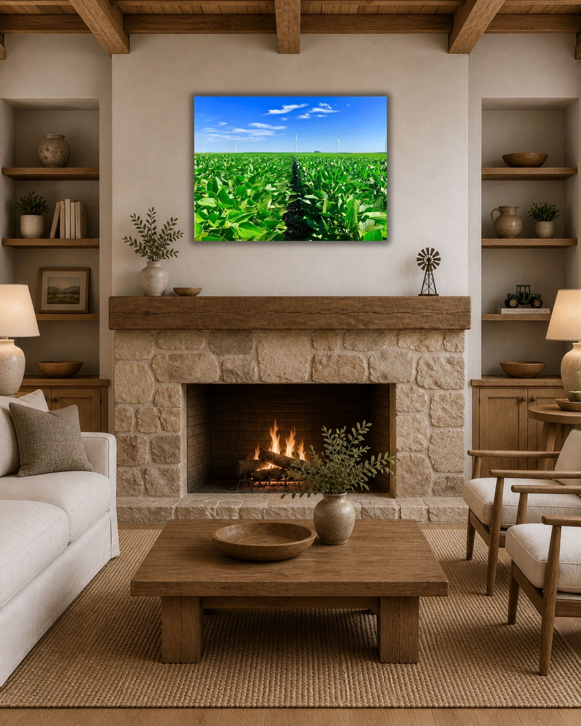 Bright green soybean rows and distant wind turbines canvas wall art styled above a stone fireplace in a farmhouse living room.