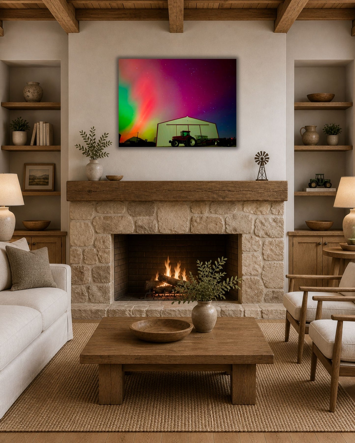 Northern lights farm canvas wall art styled above a stone fireplace in a cozy modern farmhouse living room.