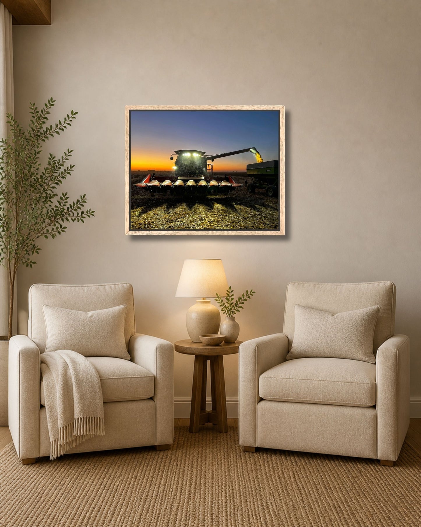 Walnut framed combine harvest sunset artwork displayed above a wood console table in a farmhouse entryway.
