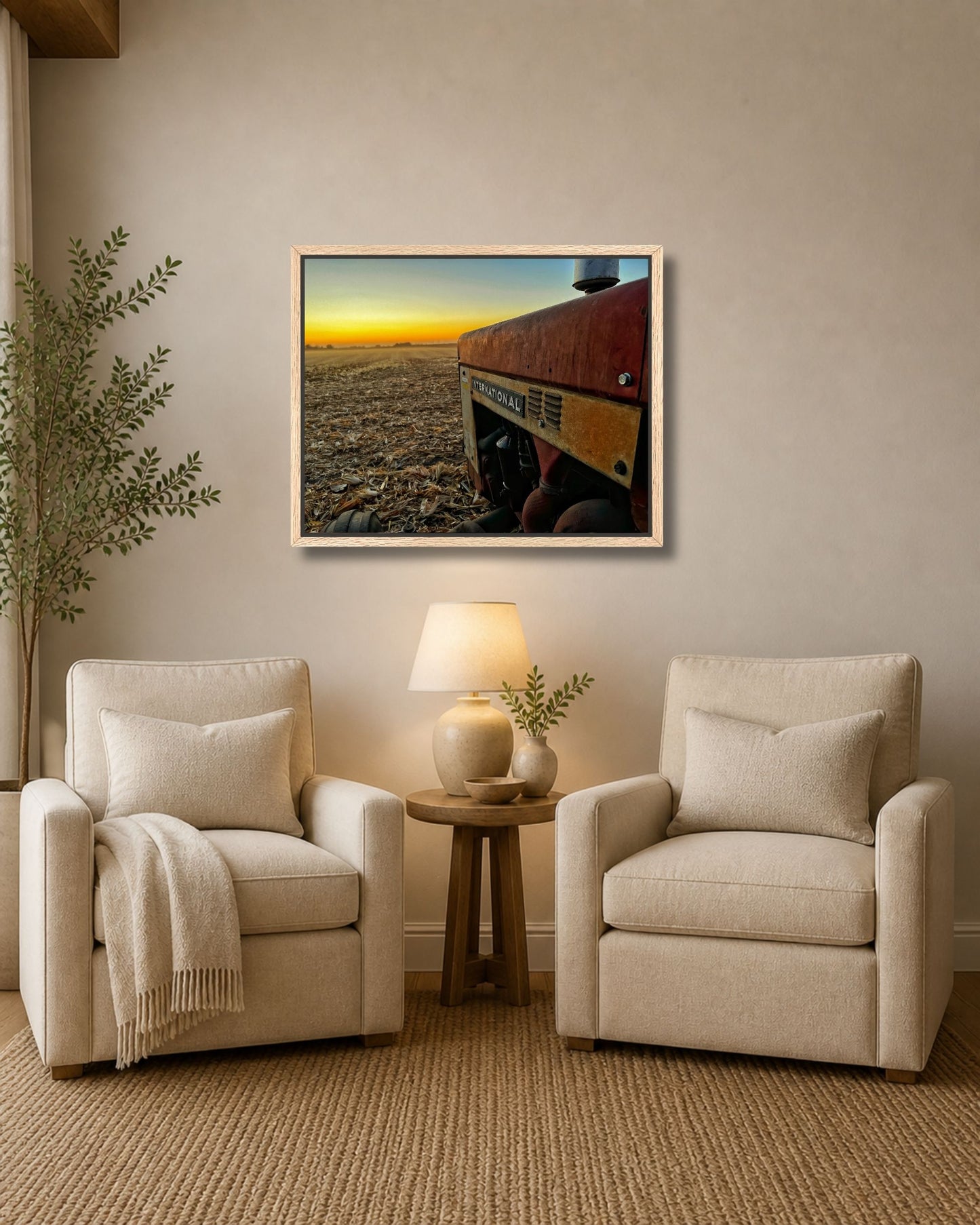 Walnut framed International tractor harvest sunset canvas wall art displayed above an entryway console in a farmhouse-style hall.