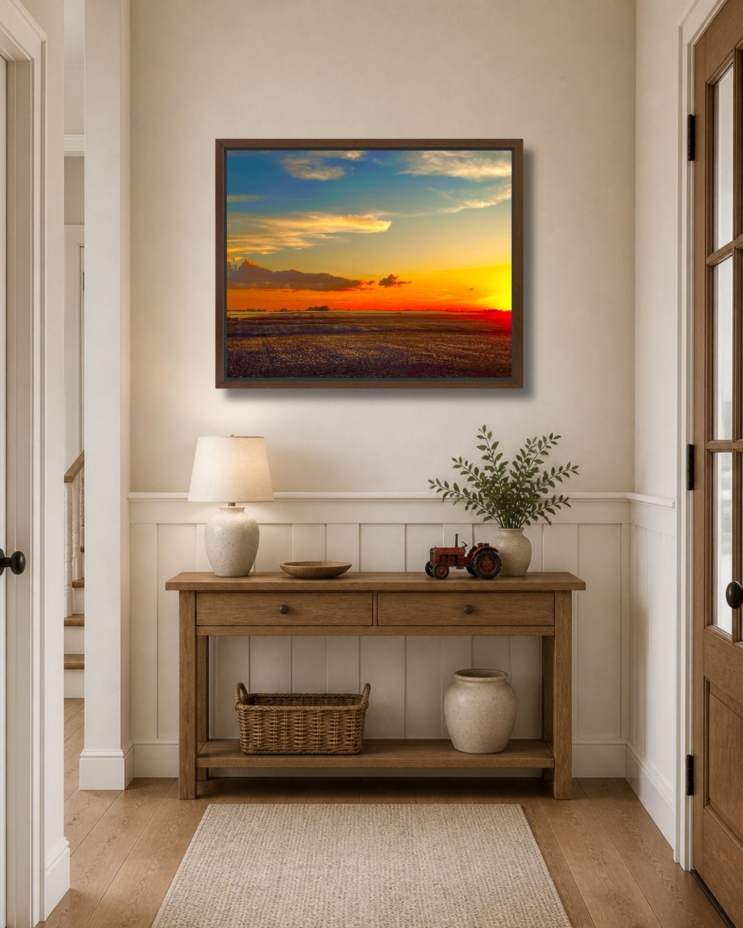Rural Midwest sunset landscape shown in a black solid wood floating frame on a light neutral wall.