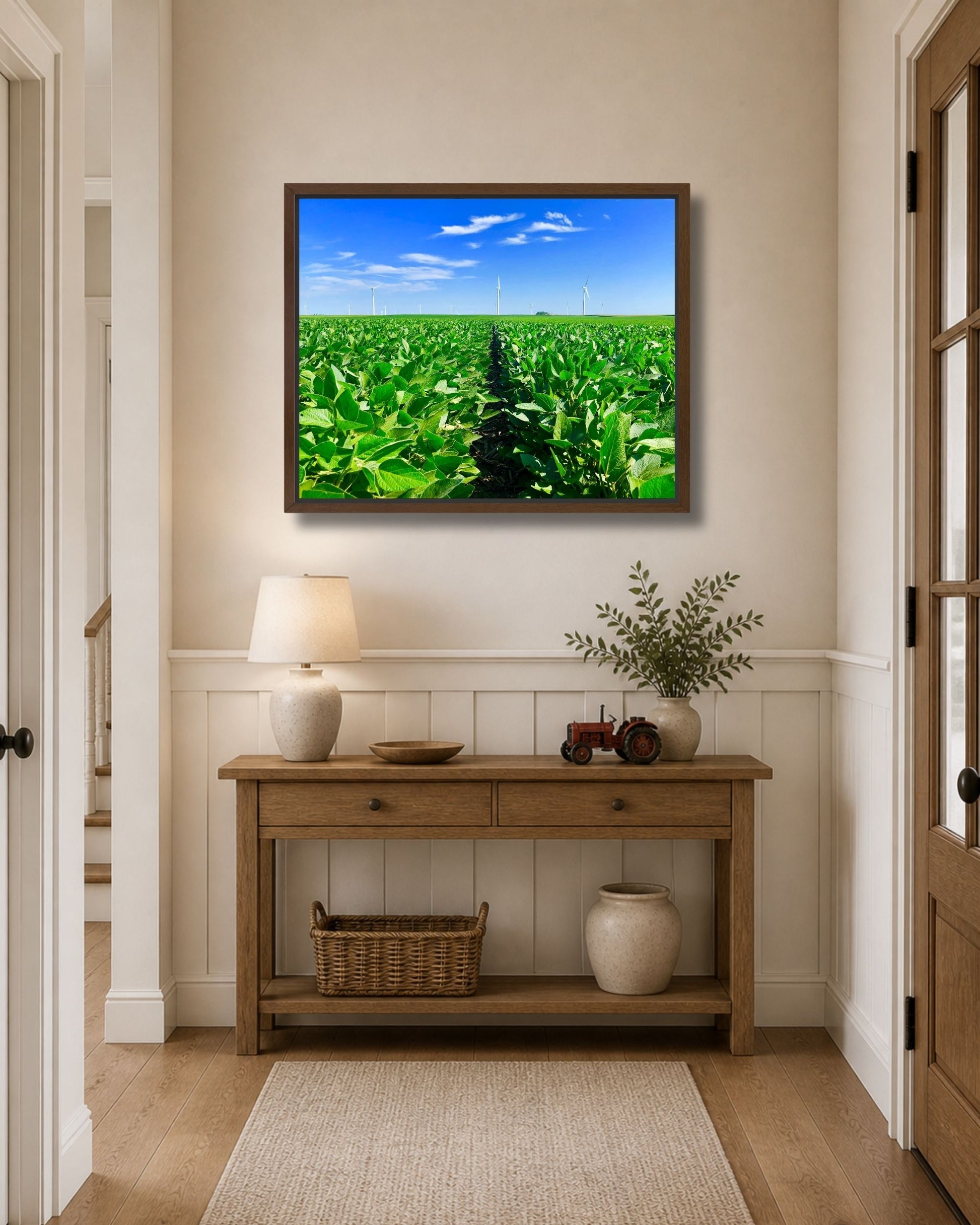 Walnut framed soybean field and wind turbines canvas wall art styled above a farmhouse entryway console table.