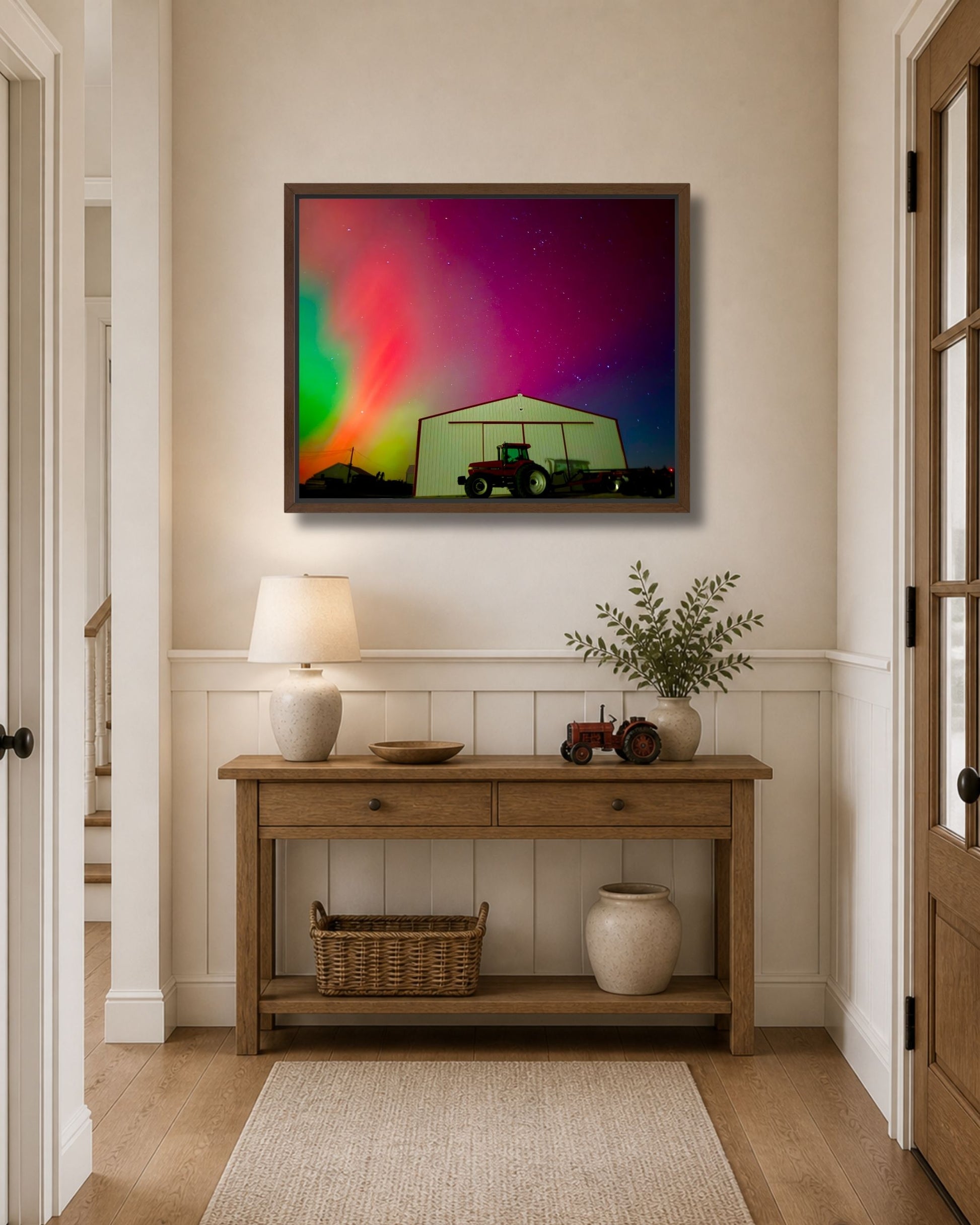 Walnut framed northern lights farm canvas wall art styled above an entryway console table with warm rustic decor.