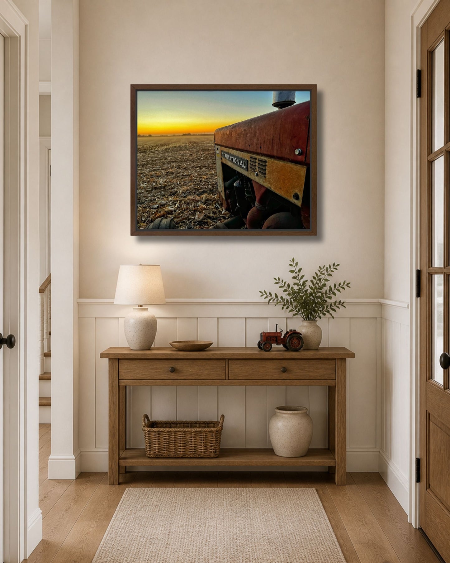 Vintage International tractor at harvest sunset canvas wall art shown in a black solid wood floating frame.
