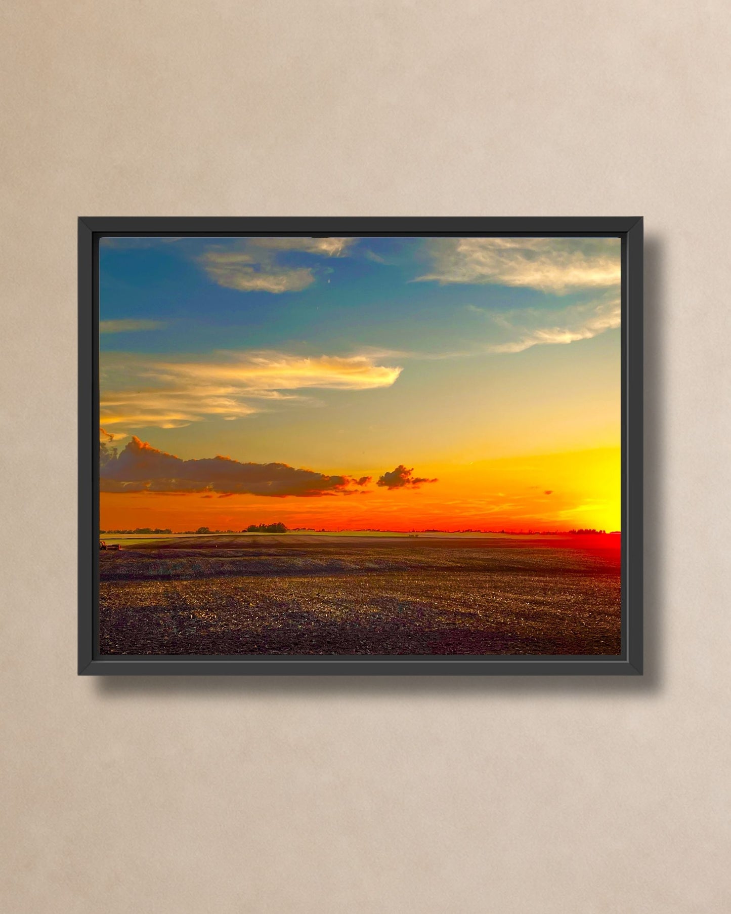Rural Iowa field sunset shown in a natural oak floating frame on a soft neutral wall.
