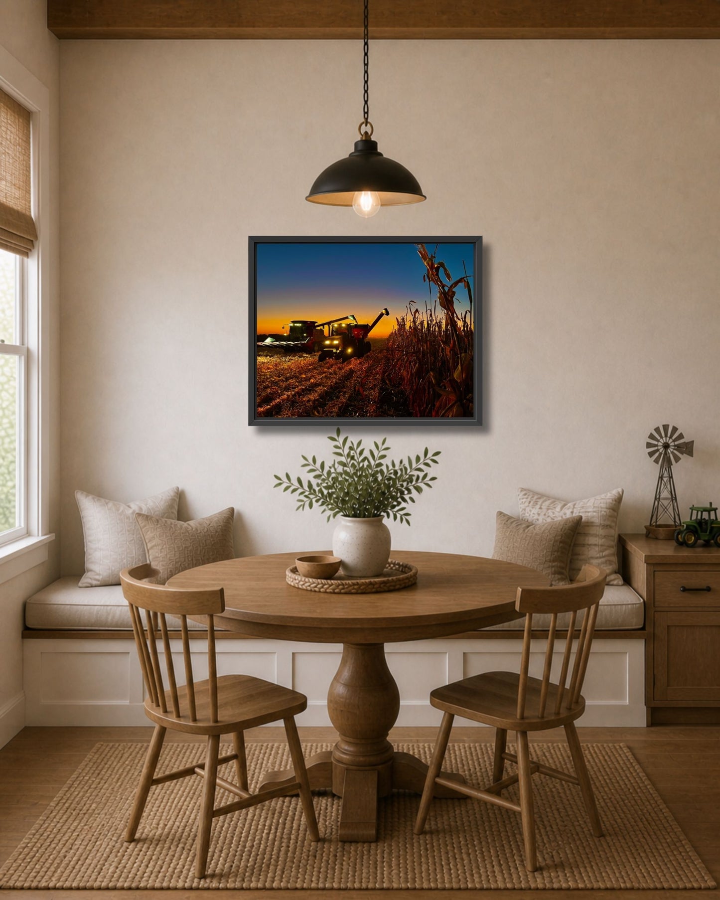 Black framed corn harvest wall art displayed above a breakfast nook table in a warm modern farmhouse interior.